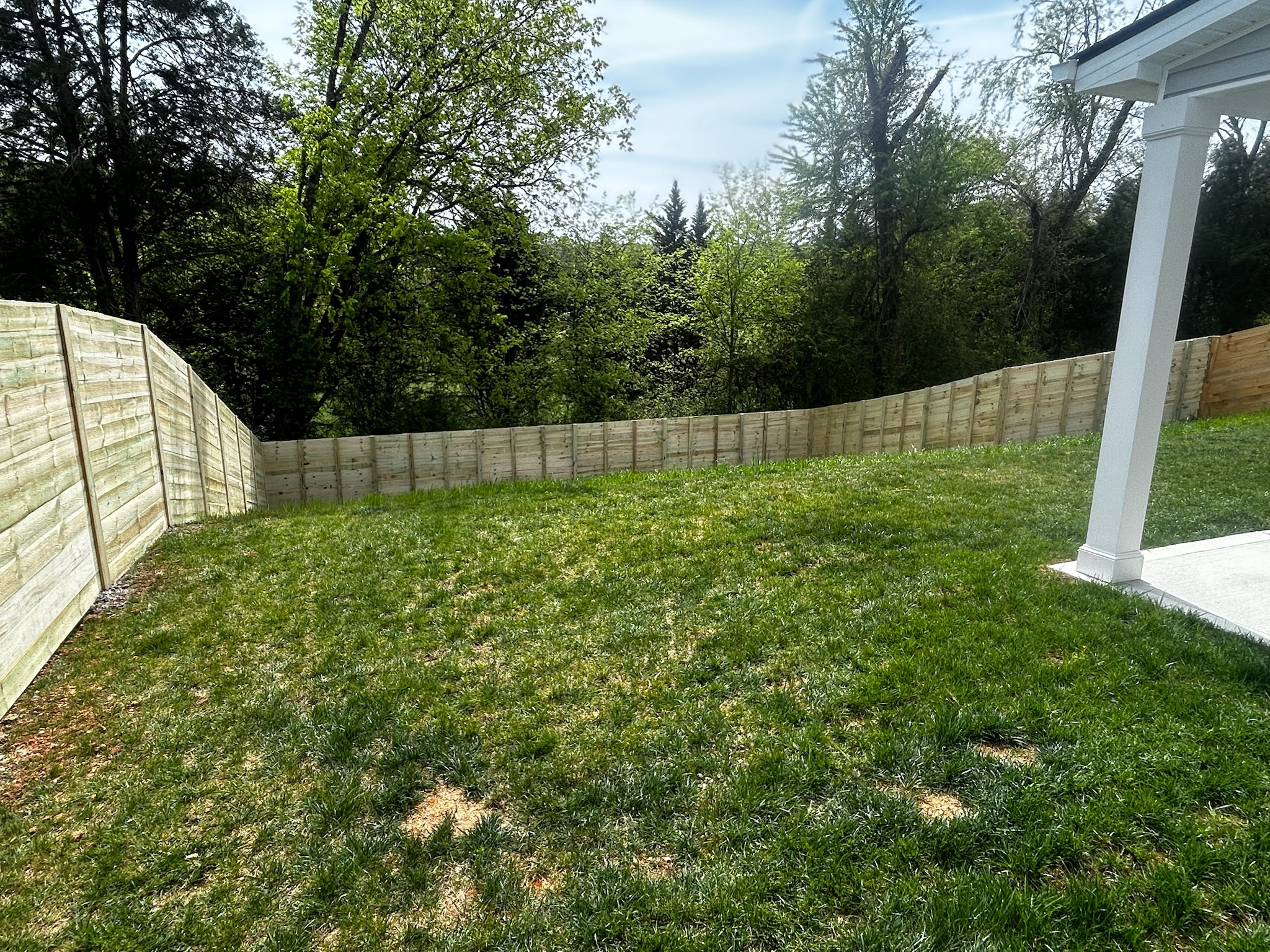 Wood fence installation in spring, residential property Knoxville TN